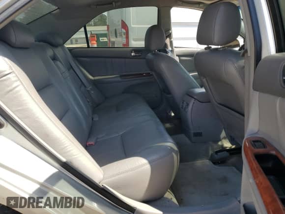 2003 Toyota Camry XLE z VIN 4T1BE32K13U252150, wystawiony jako Copart lot #82199885 z przebiegiem 297 425 mil mil oraz Szkoda całkowita • Salvage title. Historia ofert i sprzedaży dostępna na DreamBid. Obrazek 10.