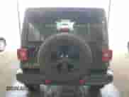 2023 Jeep Wrangler Sahara Altitude with VIN 1C4HJXEG1PW614643, listed as a Copart auction lot 52128245 with 9,890 mi miles and Clean title. Bid and sale history available at DreamBid. Image 6.