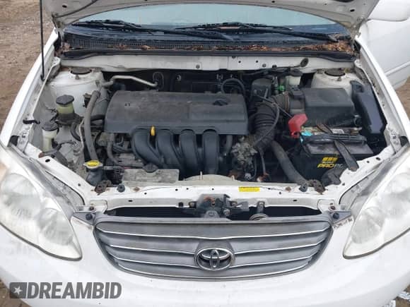 2004 Toyota Corolla CE z VIN JTDBR32E342021590, wystawiony jako IAAI lot #41693587 z przebiegiem 102 689 mil mil oraz . Historia ofert i sprzedaży dostępna na DreamBid. Obrazek 10.