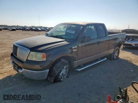 2005 Ford F-150 STX with VIN 1FTRX12W65NA22170, listed as a Copart auction lot 84585255 with 164,645 mi miles and Salvage title. Bid and sale history available at DreamBid. Image 1.