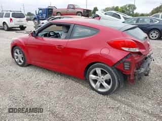 2013 Hyundai Veloster w/Black Int z VIN KMHTC6AD7DU129100, wystawiony jako IAAI lot #43459342 z przebiegiem 98 170 mil mil oraz . Historia ofert i sprzedaży dostępna na DreamBid. Obrazek 3.