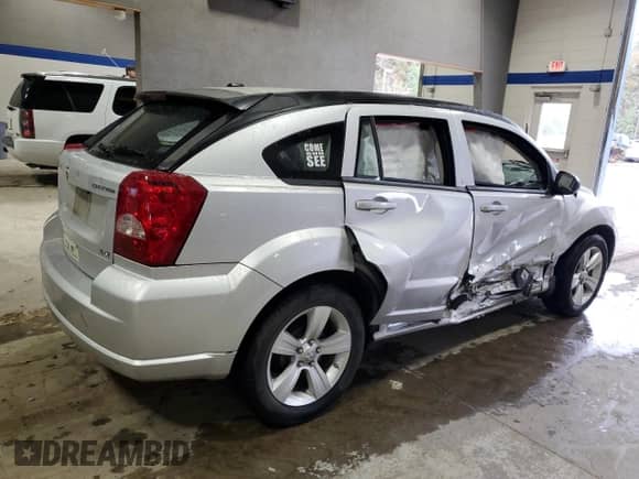 2010 Dodge Caliber SXT with VIN 1B3CB4HA6AD544462, listed as a Copart auction lot 81085784 with 20,467 mi miles and Salvage title. Bid and sale history available at DreamBid. Image 3.