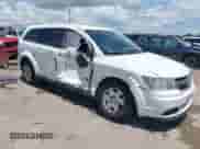 2012 Dodge Journey American Value z VIN 3C4PDCAB5CT207169, wystawiony jako IAAI lot #42357419 z przebiegiem 129 006 mil mil oraz . Historia ofert i sprzedaży dostępna na DreamBid. Obrazek 1.