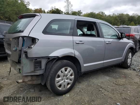 2015 Dodge Journey American Value with VIN 3C4PDCAB8FT708027, listed as a Copart auction lot 82297795 with 129,074 mi miles and Salvage title. Bid and sale history available at DreamBid. Image 3.