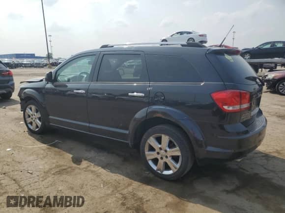 2011 Dodge Journey Crew with VIN 3D4PH3FG0BT523119, listed as a Copart auction lot 59612625 with 212,656 mi miles and Salvage title. Bid and sale history available at DreamBid. Image 2.