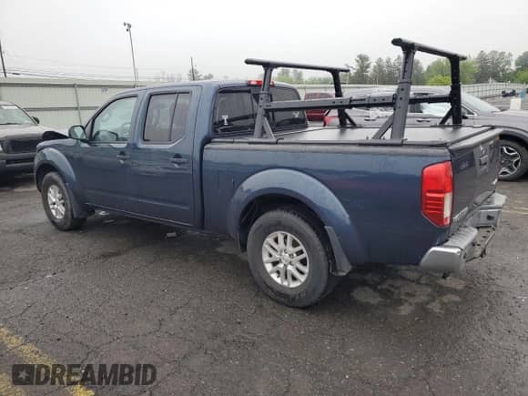 2016 Nissan Frontier SV with VIN 1N6AD0FVXGN700131, listed as a Copart auction lot 57040815 with 111,570 mi miles and Salvage title. Bid and sale history available at DreamBid. Image 2.