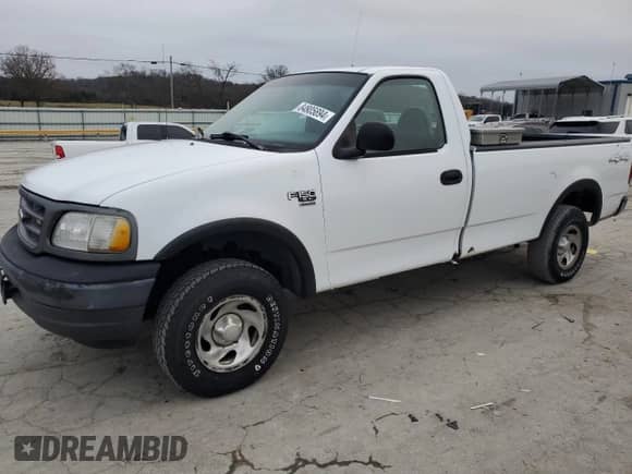 2003 Ford F-150 XL z VIN 1FTRF18W03NA77544, wystawiony jako Copart lot #84805894 z przebiegiem Nie podano mil oraz Szkoda całkowita • Salvage title. Historia ofert i sprzedaży dostępna na DreamBid. Obrazek 1.