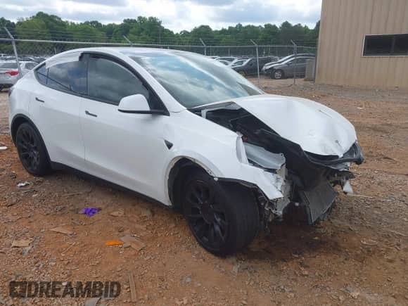 2022 Tesla Model Y Long Range z VIN 7SAYGDEE2NF385910, wystawiony jako IAAI lot #42146793 z przebiegiem 67 604 mil mil oraz . Historia ofert i sprzedaży dostępna na DreamBid. Obrazek 1.