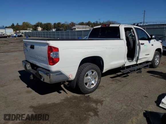 2016 Toyota Tundra SR with VIN 5TFCY5F1XGX020292, listed as a Copart auction lot 87105715 with 121,822 mi miles and Salvage title. Bid and sale history available at DreamBid. Image 3.
