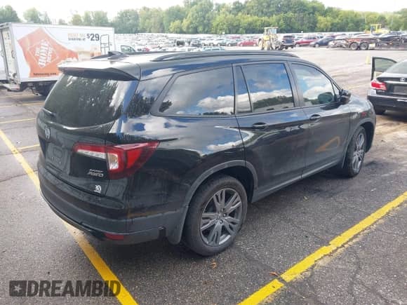 2022 Honda Pilot Sport with VIN 5FNYF6H3XNB102854, listed as a IAAI auction lot 43096219 with 33,735 mi miles and . Bid and sale history available at DreamBid. Image 4.