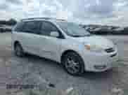 2004 Toyota Sienna XLE z VIN 5TDBA22CX4S000793, wystawiony jako Copart lot #69739105 z przebiegiem 379 960 mil mil oraz Szkoda całkowita • Salvage title. Historia ofert i sprzedaży dostępna na DreamBid. Obrazek 4.