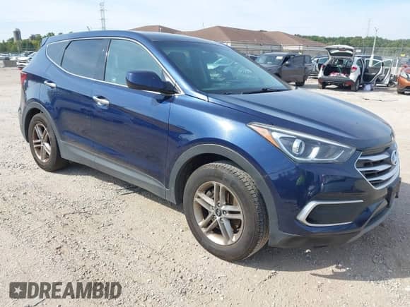 2018 Hyundai Santa Fe 2.4L z VIN 5XYZTDLB7JG562119, wystawiony jako IAAI lot #43221548 z przebiegiem 244 228 mil mil oraz . Historia ofert i sprzedaży dostępna na DreamBid. Obrazek 1.