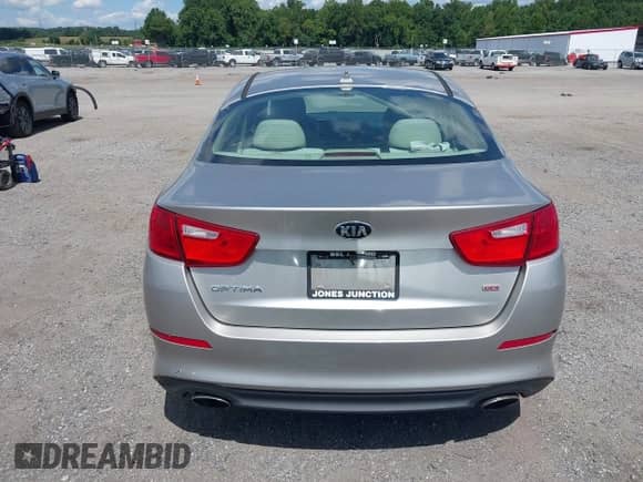 2015 Kia Optima LX with VIN 5XXGM4A75FG379610, listed as a IAAI auction lot 43074307 with 121,698 mi miles and . Bid and sale history available at DreamBid. Image 16.
