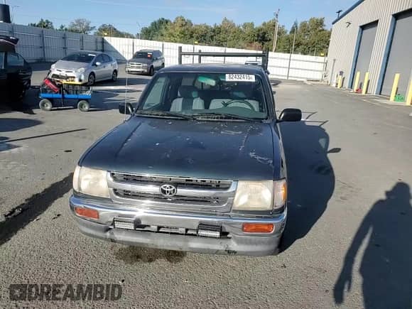 1997 Toyota Tacoma with VIN 4TAVL52N7VZ330736, listed as a Copart auction lot 82432415 with 376,229 mi miles and Salvage title. Bid and sale history available at DreamBid. Image 13.