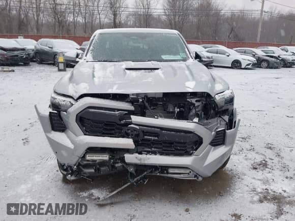 2024 Toyota Tacoma SR5 with VIN 3TMLB5JN6RM018639, listed as a IAAI auction lot 41251861 with 10,088 mi miles and . Bid and sale history available at DreamBid. Image 12.
