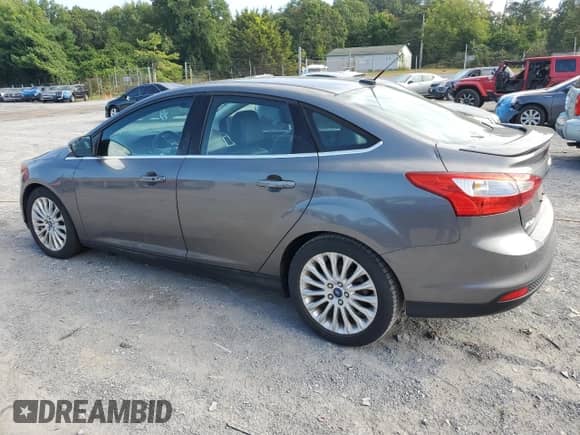 2012 Ford Focus Titanium with VIN 1FAHP3J27CL412974, listed as a Copart auction lot 69800475 with 95,073 mi miles and Salvage title. Bid and sale history available at DreamBid. Image 2.