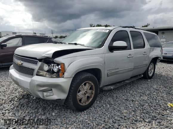2011 Chevrolet Suburban LT with VIN 1GNSCJE0XBR166076, listed as a Copart auction lot 85882165 with 169,114 mi miles and Salvage title. Bid and sale history available at DreamBid. Image 1.