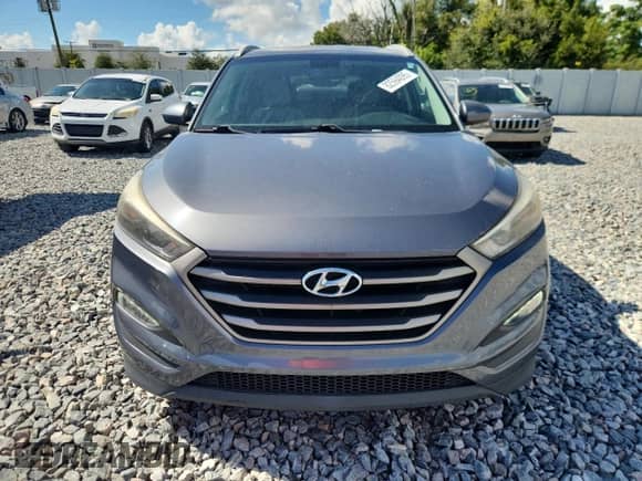 2016 Hyundai Tucson SE z VIN KM8J33A42GU225629, wystawiony jako Copart lot #82594095 z przebiegiem 99 155 mil mil oraz Szkoda całkowita • Salvage title. Historia ofert i sprzedaży dostępna na DreamBid. Obrazek 5.