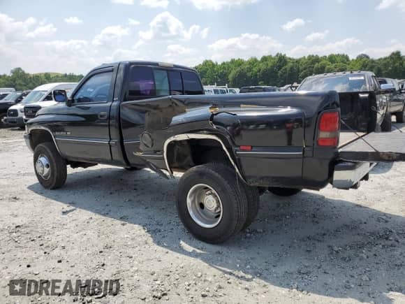 1994 Dodge RAM with VIN 1B7MF3654RS708967, listed as a Copart auction lot 59077115 with 89,023 mi miles and Salvage title. Bid and sale history available at DreamBid. Image 2.