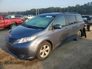 2015 Toyota Sienna LE with VIN 5TDKK3DC7FS647056, listed as a Copart auction lot 71981905 with 104,576 mi miles and Salvage title. Bid and sale history available at DreamBid. Image 1.