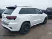 2016 Jeep Grand Cherokee SRT with VIN 1C4RJFDJ0GC456325, listed as a IAAI auction lot 41425211 with 159,746 mi miles and . Bid and sale history available at DreamBid. Image 4.