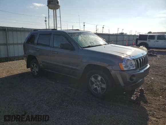 2007 Jeep Grand Cherokee Laredo with VIN 1J8GR48KX7C593322, listed as a Copart auction lot 71458485 with 166,252 mi miles and Salvage title. Bid and sale history available at DreamBid. Image 4.