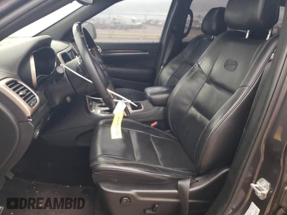 2016 Jeep Grand Cherokee High Altitude with VIN 1C4RJECG4GC314575, listed as a Copart auction lot 84265744 with 129,144 mi miles and Salvage title. Bid and sale history available at DreamBid. Image 7.