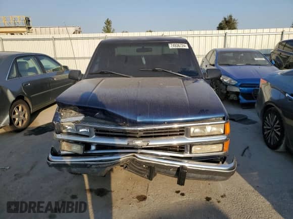 1999 Chevrolet Silverado 1500 with VIN 1GCEC19R7XR140542, listed as a Copart auction lot 74936724 with 348,313 mi miles and Salvage title. Bid and sale history available at DreamBid. Image 5.