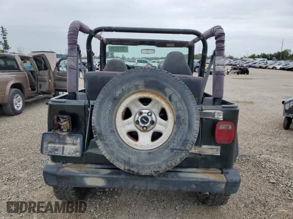 1998 Jeep Wrangler SE z VIN 1J4FY29P1WP763752, wystawiony jako Copart lot #70510885 z przebiegiem 228 480 mil mil oraz Szkoda całkowita • Salvage title. Historia ofert i sprzedaży dostępna na DreamBid. Obrazek 6.
