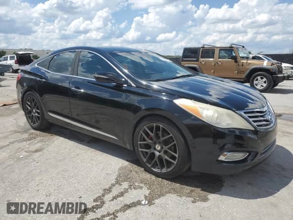 2014 Hyundai Azera Limited с VIN KMHFH4JG4EA366658, выставлен на аукционе Copart как лот 69089175 с пробегом 143 254 миль миль и Списание • Salvage title. История ставок и продаж доступна на DreamBid. Изображение 4.