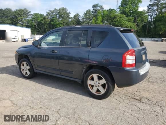 2007 Jeep Compass Sport with VIN 1J8FT47W47D221924, listed as a Copart auction lot 56949875 with 193,909 mi miles and Clean title. Bid and sale history available at DreamBid. Image 2.