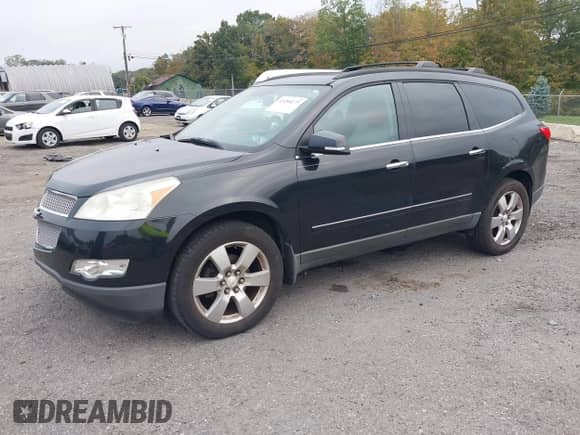 2011 Chevrolet Traverse LTZ z VIN 1GNKVLEDXBJ144490, wystawiony jako IAAI lot #43288275 z przebiegiem Nie podano mil oraz . Historia ofert i sprzedaży dostępna na DreamBid. Obrazek 2.