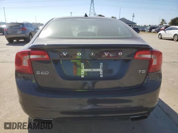 2015 Volvo S60 with VIN YV126MFD0F1309666, listed as a Copart auction lot 77844894 with 130,570 mi miles and Salvage title. Bid and sale history available at DreamBid. Image 6.