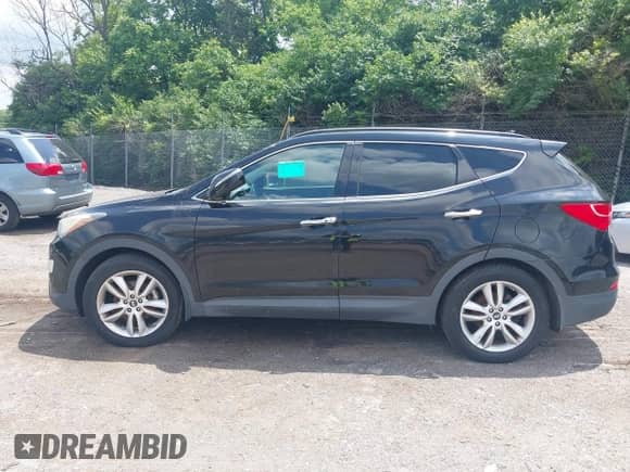 2014 Hyundai Santa Fe with VIN 5XYZWDLA0EG189400, listed as a IAAI auction lot 42391658 with 51,911 mi miles and . Bid and sale history available at DreamBid. Image 14.