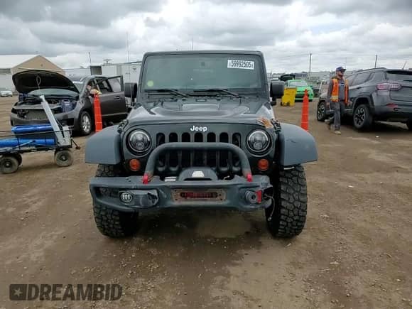 2013 Jeep Wrangler Rubicon 10th Anniversary with VIN 1C4BJWCG7DL677164, listed as a Copart auction lot 59992505 with 120,000 mi miles and Salvage title. Bid and sale history available at DreamBid. Image 15.