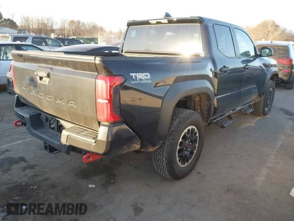 2024 Toyota Tacoma SR5 with VIN 3TYLB5JN3RT032583, listed as a IAAI auction lot 41404527 with 7,130 mi miles and . Bid and sale history available at DreamBid. Image 4.