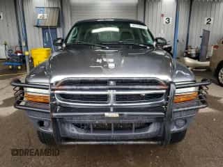 2004 Dodge Dakota z VIN 1D7HG12K44S556475, wystawiony jako Copart lot #82159875 z przebiegiem 148 437 mil mil oraz Nie do naprawy • Non repairable. Historia ofert i sprzedaży dostępna na DreamBid. Obrazek 5.