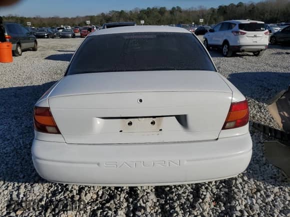 2001 Saturn SL z VIN 1G8ZH52801Z239295, wystawiony jako Copart lot #87857705 z przebiegiem 169 063 mil mil oraz Szkoda całkowita • Salvage title. Historia ofert i sprzedaży dostępna na DreamBid. Obrazek 6.