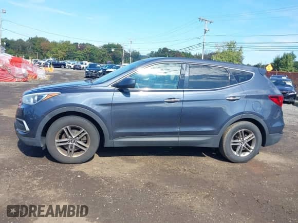2018 Hyundai Santa Fe 2.4L with VIN 5NMZTDLB9JH071864, listed as a IAAI auction lot 43302156 with 127,581 mi miles and . Bid and sale history available at DreamBid. Image 14.
