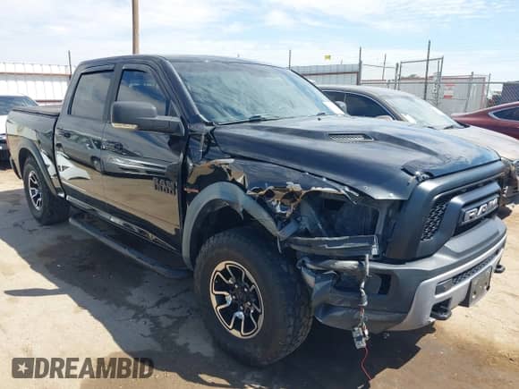 2016 Ram 1500 Rebel z VIN 1C6RR7YT2GS175313, wystawiony jako IAAI lot #43202802 z przebiegiem 148 704 mil mil oraz . Historia ofert i sprzedaży dostępna na DreamBid. Obrazek 1.