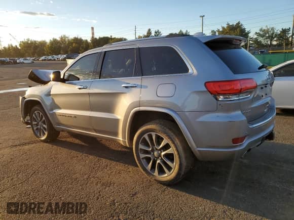 2017 Jeep Grand Cherokee Overland with VIN 1C4RJFCGXHC756588, listed as a Copart auction lot 84282675 with 101,960 mi miles and Salvage title. Bid and sale history available at DreamBid. Image 2.