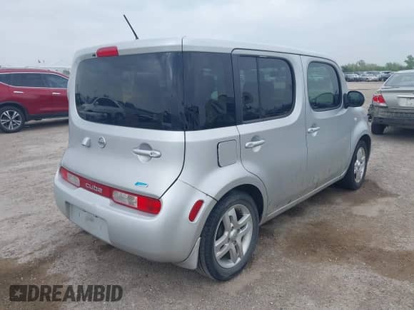 2013 Nissan Cube S with VIN JN8AZ2KR1DT304769, listed as a IAAI auction lot 41941411 with 64,518 mi miles and . Bid and sale history available at DreamBid. Image 4.