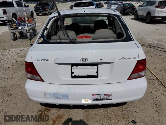 2002 Hyundai Accent GS z VIN KMHCG35C82U230535, wystawiony jako Copart lot #77709454 z przebiegiem 116 200 mil mil oraz Nie do naprawy • Non repairable. Historia ofert i sprzedaży dostępna na DreamBid. Obrazek 6.