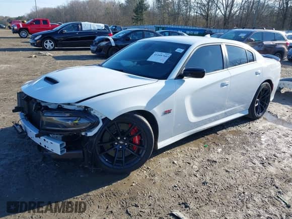 2023 Dodge Charger Scat Pack with VIN 2C3CDXGJ4PH626959, listed as a IAAI auction lot 41448760 with 13,201 mi miles and . Bid and sale history available at DreamBid. Image 2.
