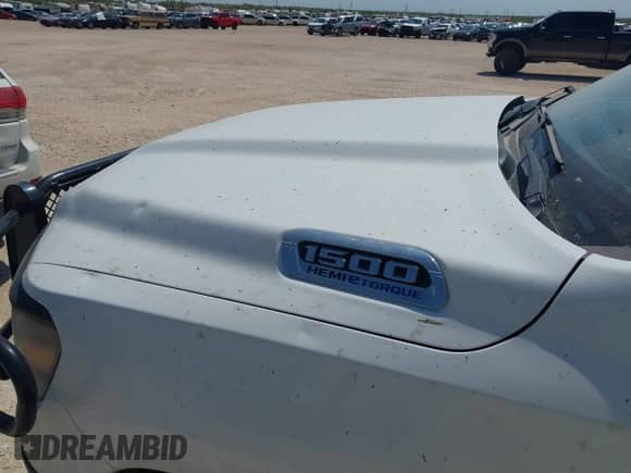 2023 Ram 1500 Tradesman z VIN 1C6SRFGT5PN553622, wystawiony jako IAAI lot #42935816 z przebiegiem 89 940 mil mil oraz . Historia ofert i sprzedaży dostępna na DreamBid. Obrazek 6.