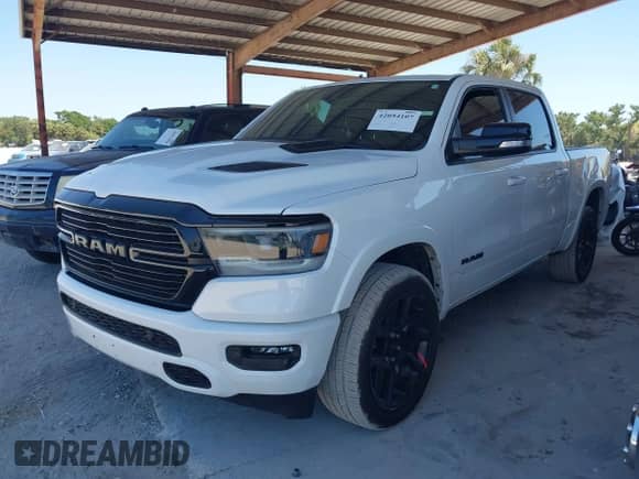 2021 Ram 1500 Laramie with VIN 1C6RREJTXMN794380, listed as a IAAI auction lot 42054107 with 73,370 mi miles and . Bid and sale history available at DreamBid. Image 2.