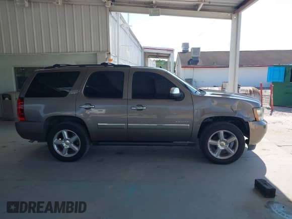2011 Chevrolet Tahoe LTZ with VIN 1GNSCCE09BR333023, listed as a IAAI auction lot 43085215 with 165,616 mi miles and . Bid and sale history available at DreamBid. Image 13.
