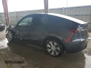 2022 Tesla Model Y Long Range with VIN 7SAYGDEE9NA005748, listed as a Copart auction lot 62662084 with 19,912 mi miles and Non repairable. Bid and sale history available at DreamBid. Image 2.