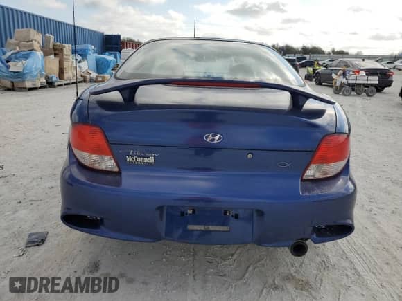 2001 Hyundai Tiburon с VIN KMHJG25F31U243512, выставлен на аукционе Copart как лот 44517465 с пробегом 49 540 миль миль и Списание • Salvage title. История ставок и продаж доступна на DreamBid. Изображение 6.