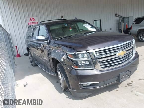 2015 Chevrolet Suburban LTZ z VIN 1GNSCKKCXFR627304, wystawiony jako IAAI lot #42826425 z przebiegiem 137 294 mil mil oraz . Historia ofert i sprzedaży dostępna na DreamBid. Obrazek 13.